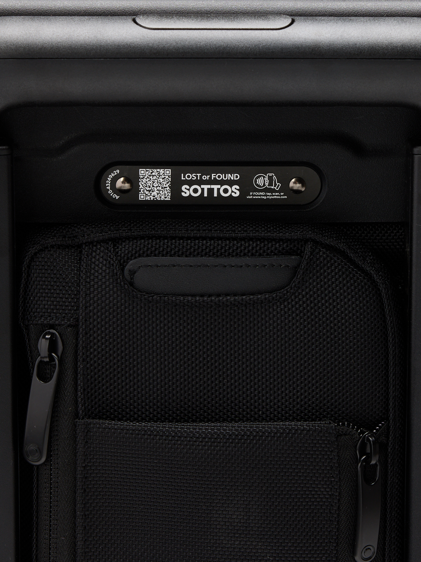 Back view of the Carry-on bag featuring QR code for registering your luggage. Text reads: "Lost or Found: SOTTOS".