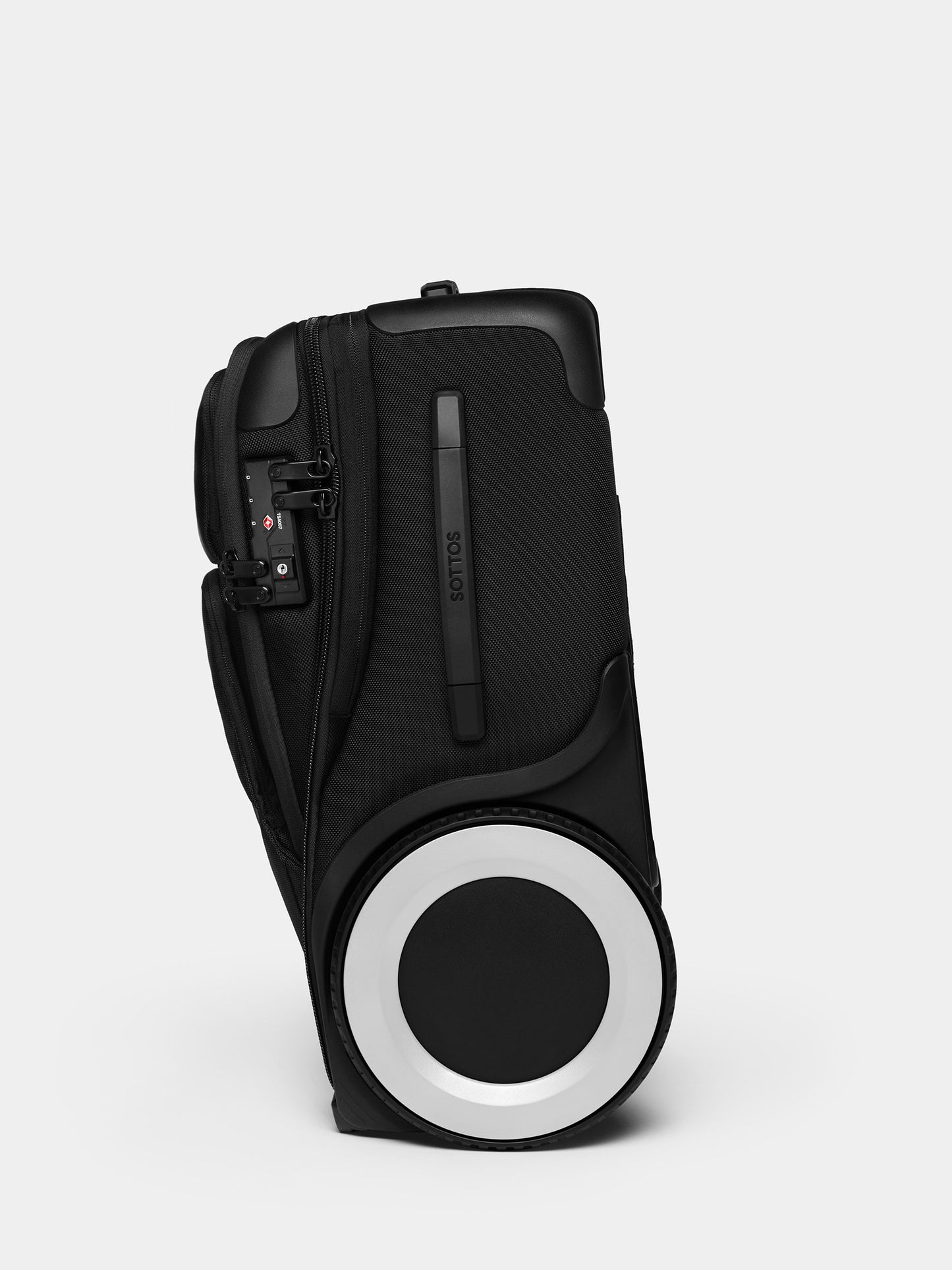 A side view of a black Roll Model Carry On featuring a big white wheel.