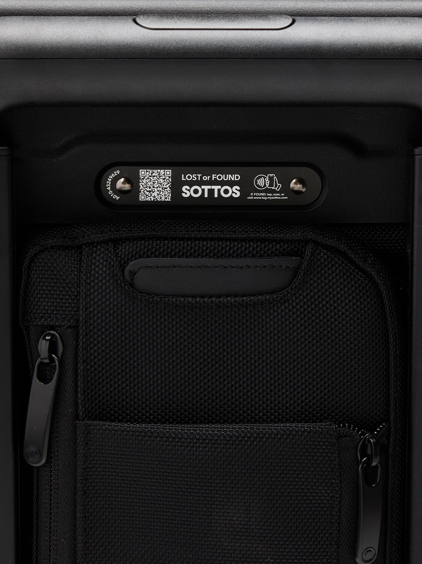 Back view of the Carry-on bag featuring QR code for registering your luggage. Text reads: "Lost or Found: SOTTOS". 